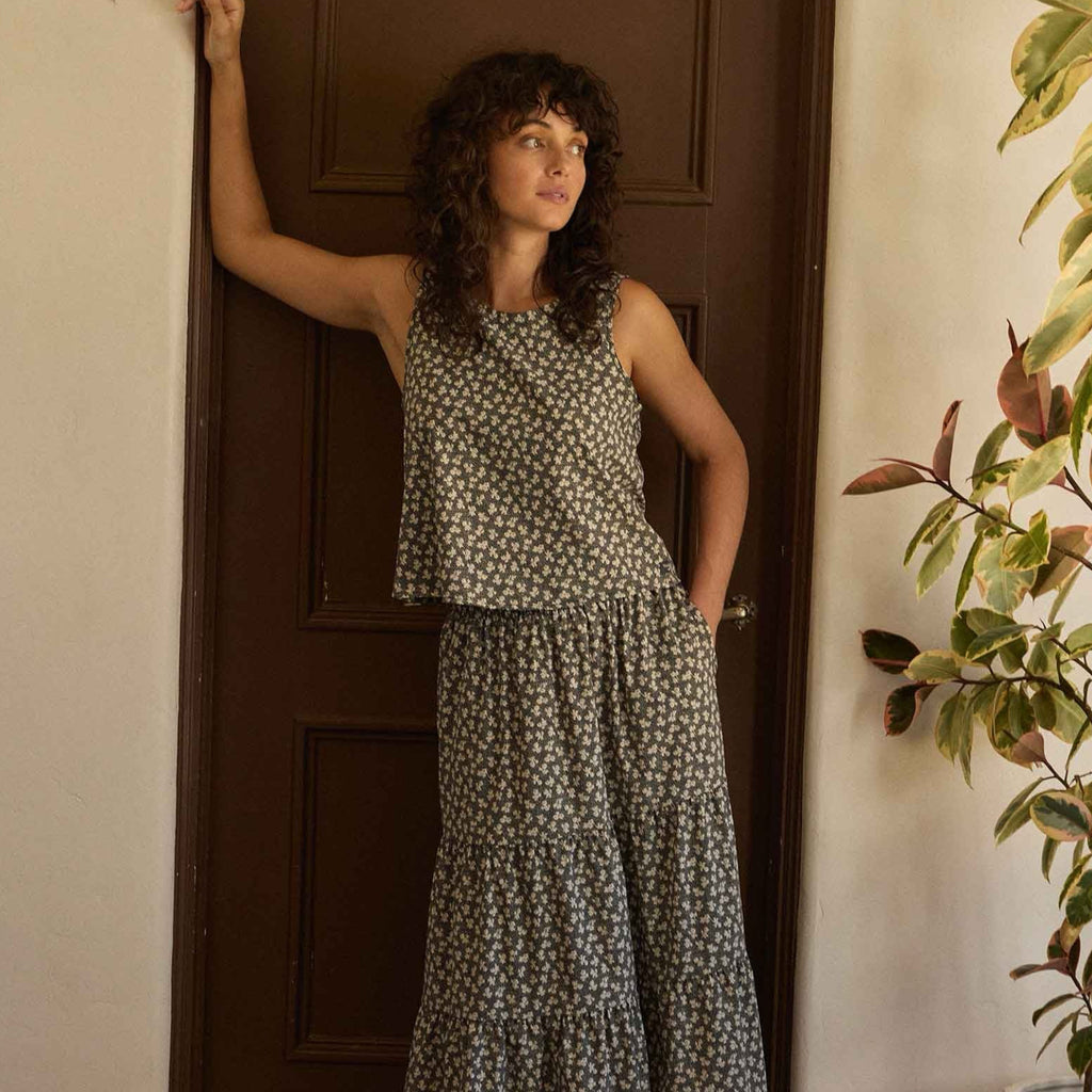 Woman wearing the Toad&Co Sunkissed Button Back Tank in Black and Salt Print