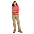Woman wearing Women's No Fly Zone Mid-Rise Pants in Briar while hiking outdoors